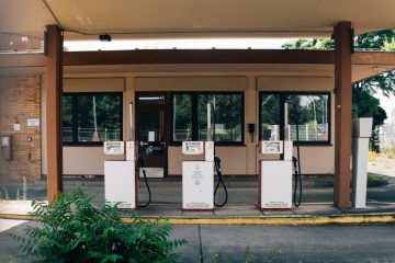 Gas pumps falling into disrepair following a gas station foreclosure.